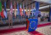EUCAP Holds Medal Parade at Somaliland Field Office EU officials and mission personnel attend a medal parade at the EUCAP Somaliland field office, with European and national flags displayed in the background.